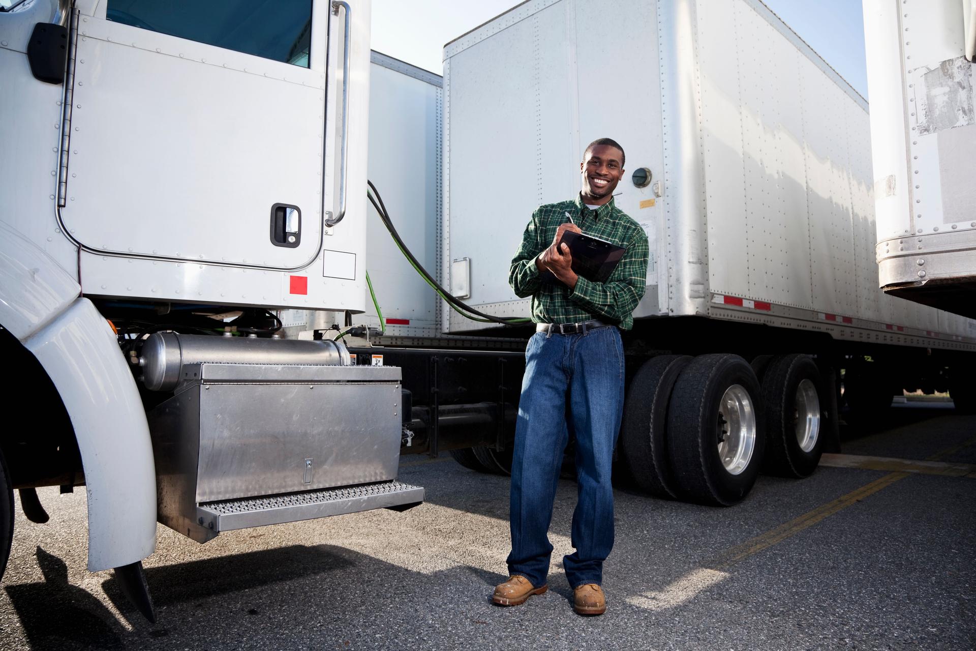 African American truck driver with clipboard